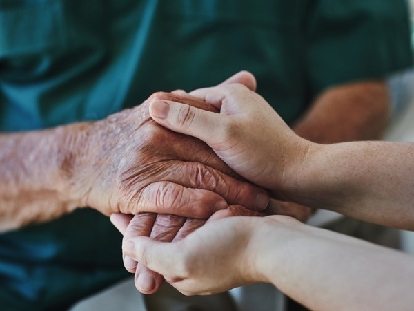 2 people holding hands